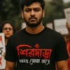 A Bengali unisex t-shirt worn by a model that says - Sirdara ekhono soja ache