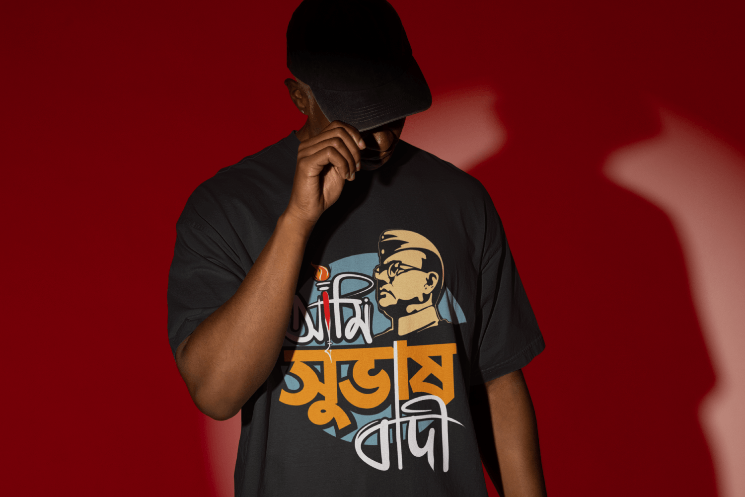A man wearing a Bengali T-shirt from Bong Street. The print on the t-shirt says Ami Subhashbadi that pays respect to the national hero Netaji Subhash Chandra Bose.