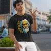 A model wearing a Black unisex t-shirt from BongStreet. The Bengali design shows an animated face of Rabindranath Tagore and the Bengali text says - Chitto jetha bhoyshunyo, Uccho jetha shir.