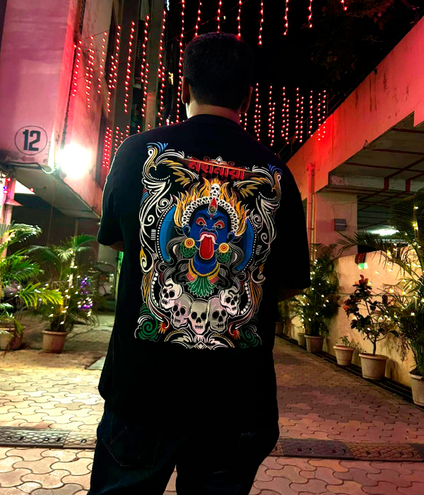 A customer of BongStreet is wearing Mahamaya oversized t-shirt in black color.